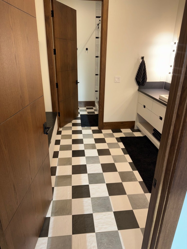 Checkerboard tile floor in black-and-white kids bathroom